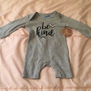 “HIGH EQ” baby onesie tags on